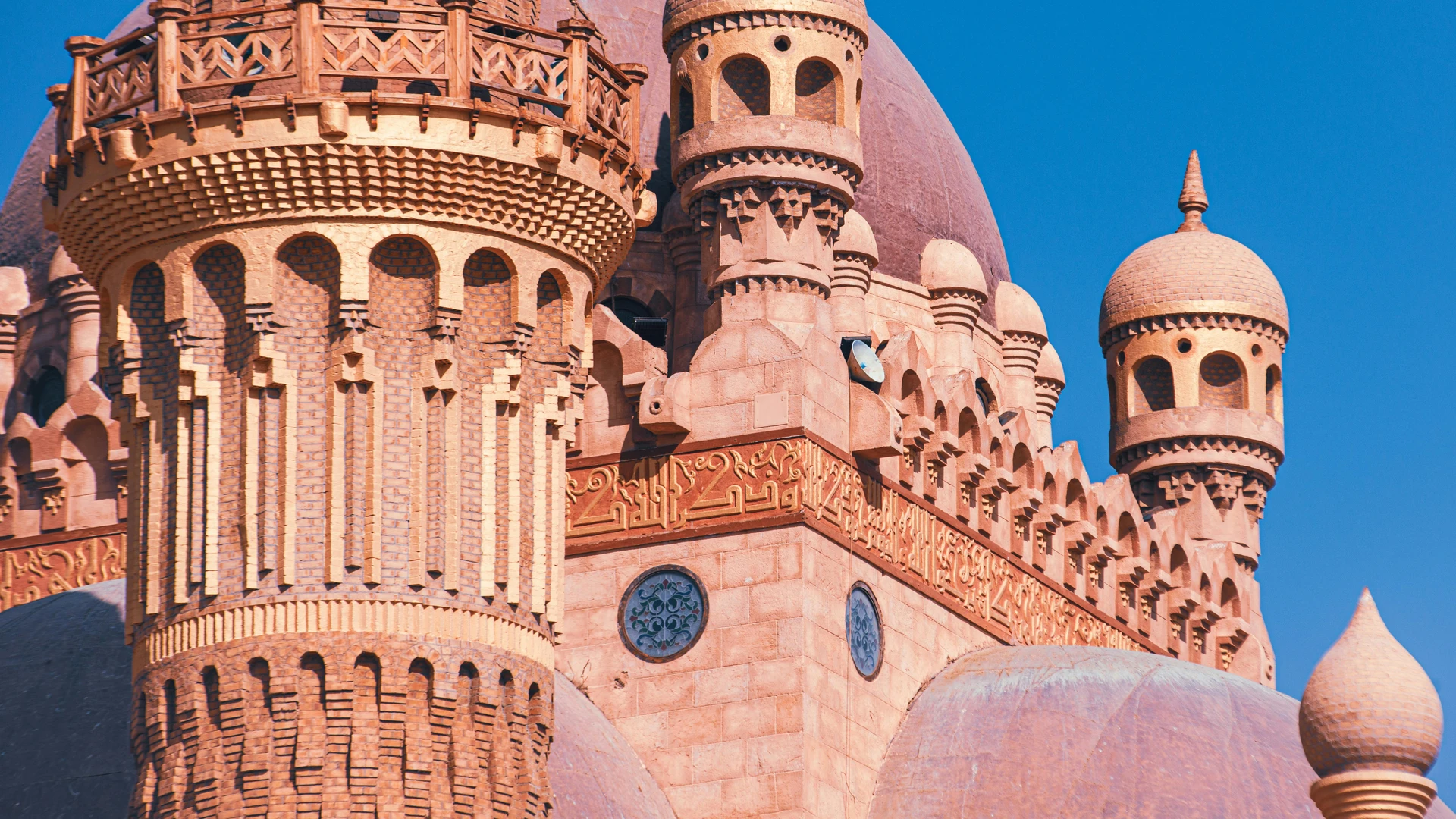 El Gouna, Egypt - Intricate architecture of the sahaba mosque in sharm el sheikh under a clear blue sky.