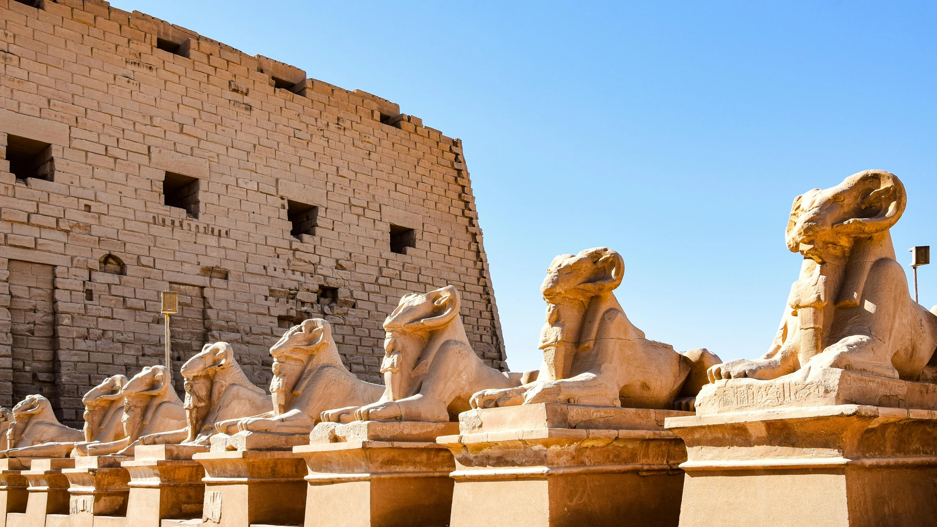 Luxor, Egypt - Row of ancient sphinx statues at the historic karnak temple complex in luxor, egypt.