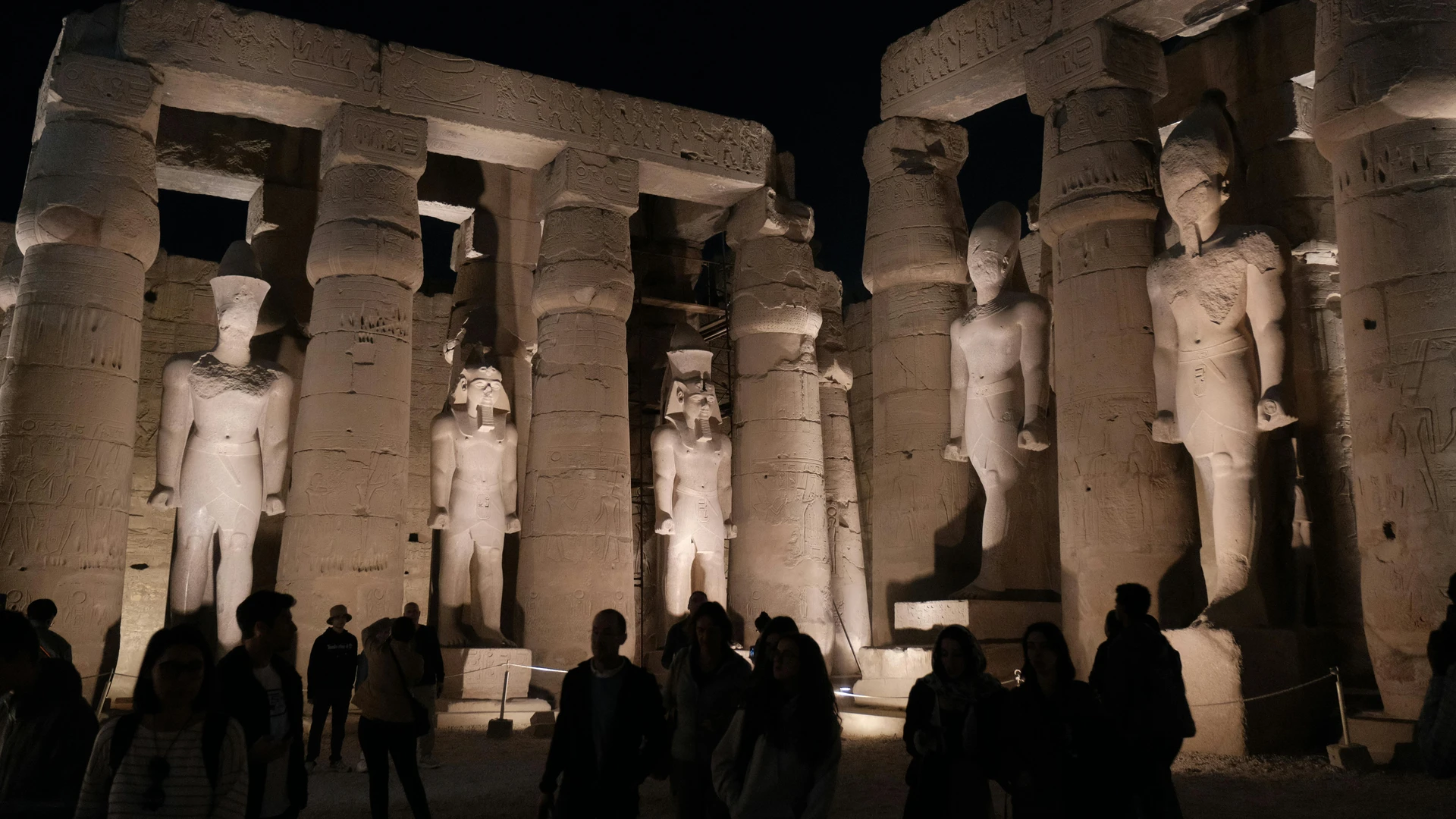 Luxor, Egypt - Illuminated statues at luxor temple under the night sky, showcasing egyptian history.