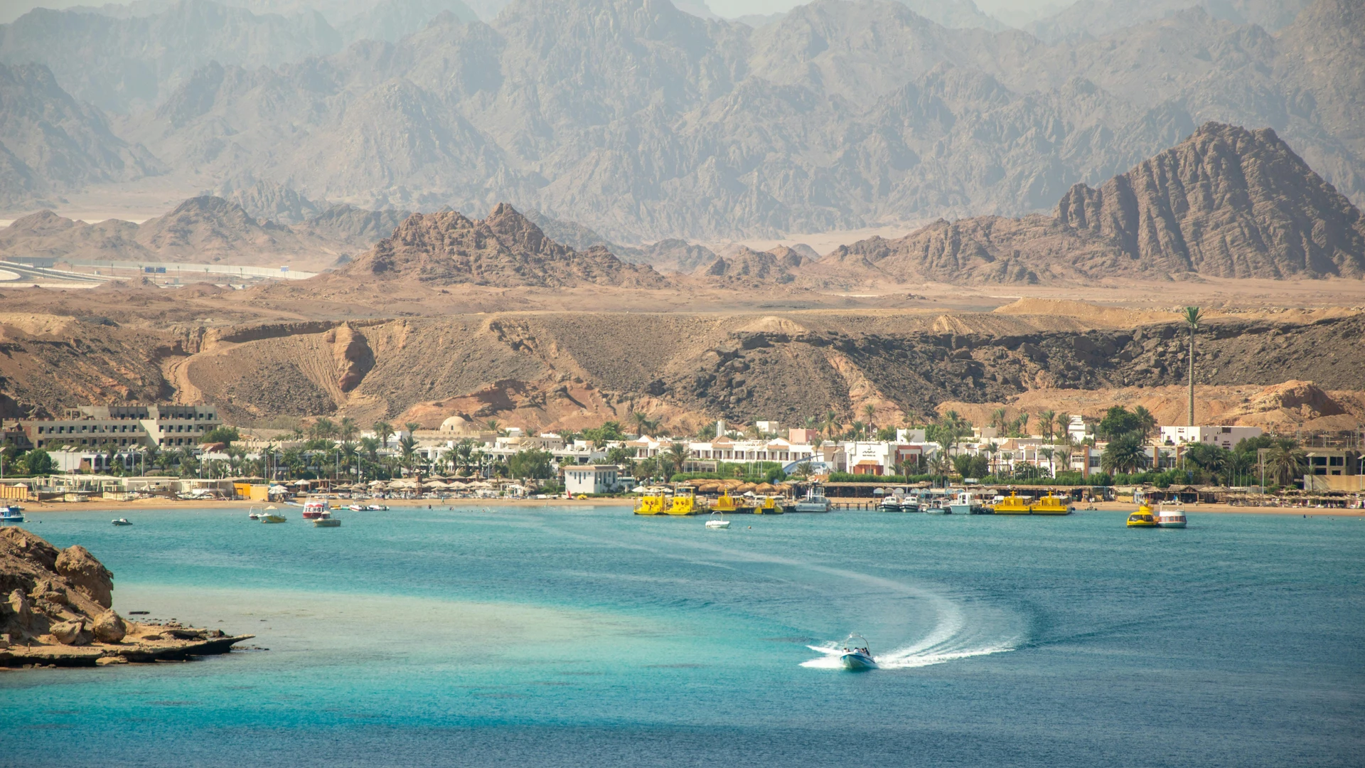 Makadi Bay, Egypt - Stunning seaside town with turquoise waters and rugged mountains.
