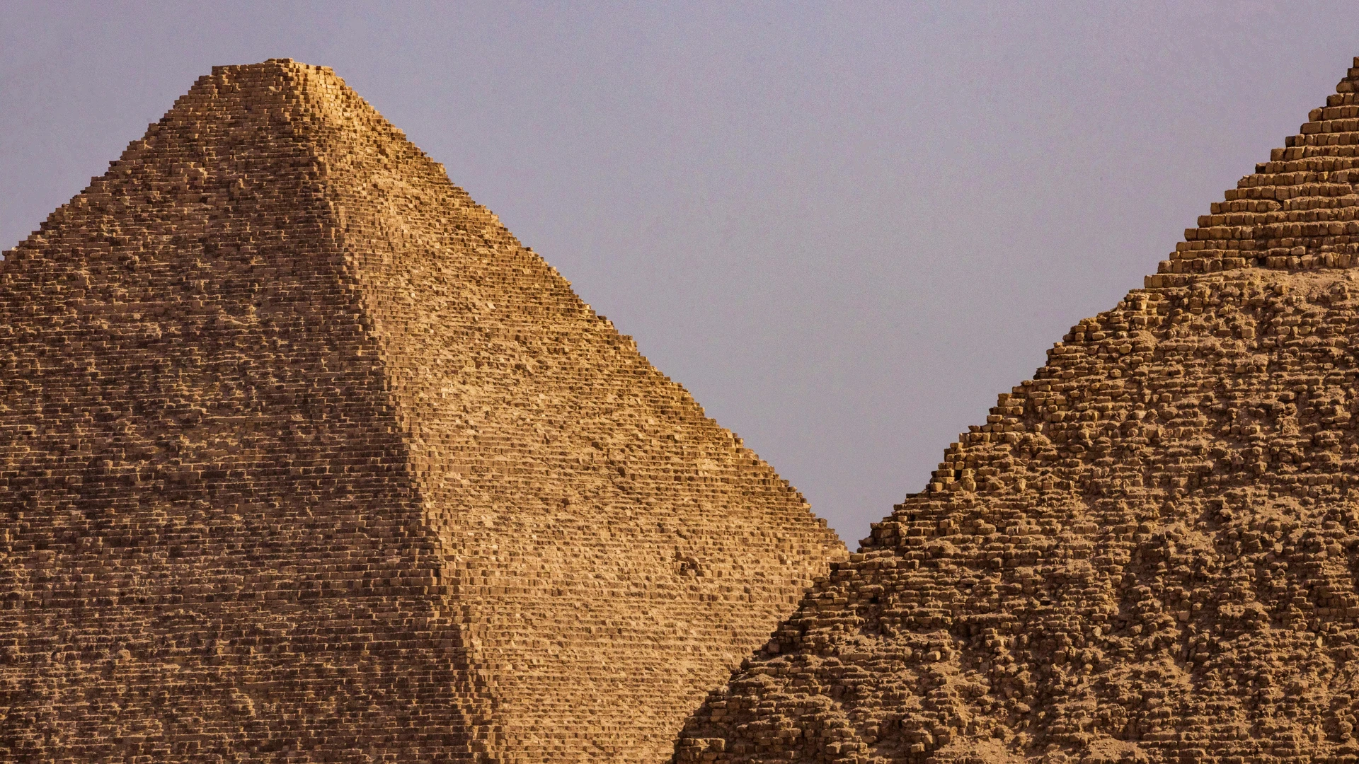 Hurghada, Egypt - Close-up view of two iconic egyptian pyramids under a clear blue sky.