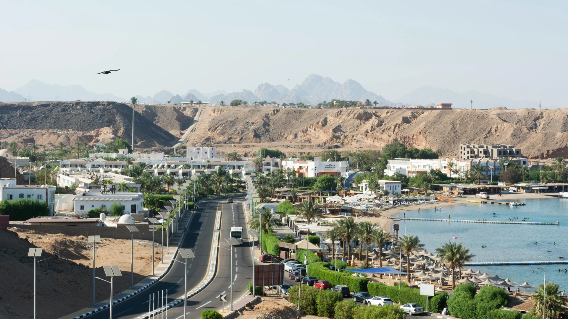 Sharm El Sheikh, Egypt - Panoramic aerial view of the sharm el sheikh coastline and surrounding cityscape, featuring sandy desert hills.